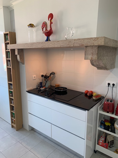 The thick stone ledge above our kitchen stove.