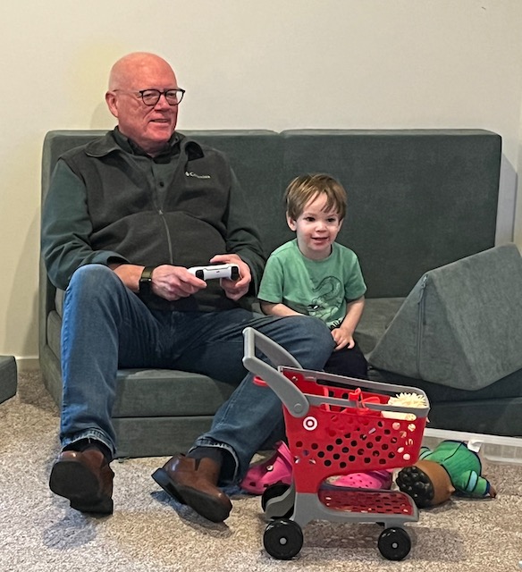 Guy (right) teaching Mike how to play video games.