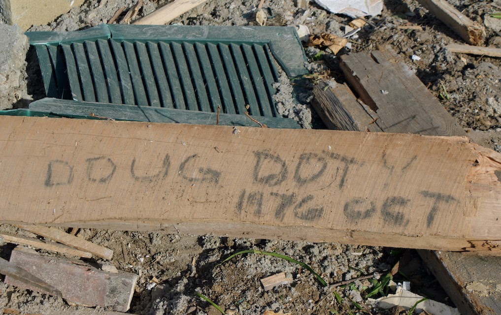 A piece of a floor joist removed from our old house in Indiana, 2013. Written on it is "Doug Doty 1976 Oct".