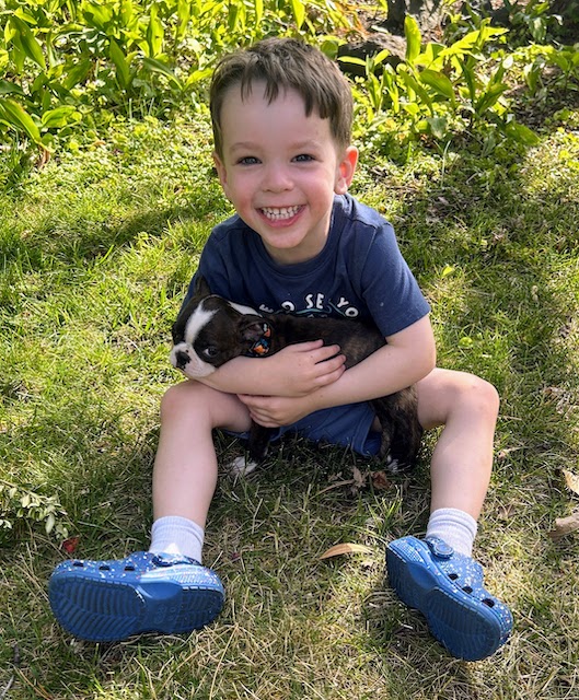 Our grandson, Guy William, with Lily after she arrived at our home.