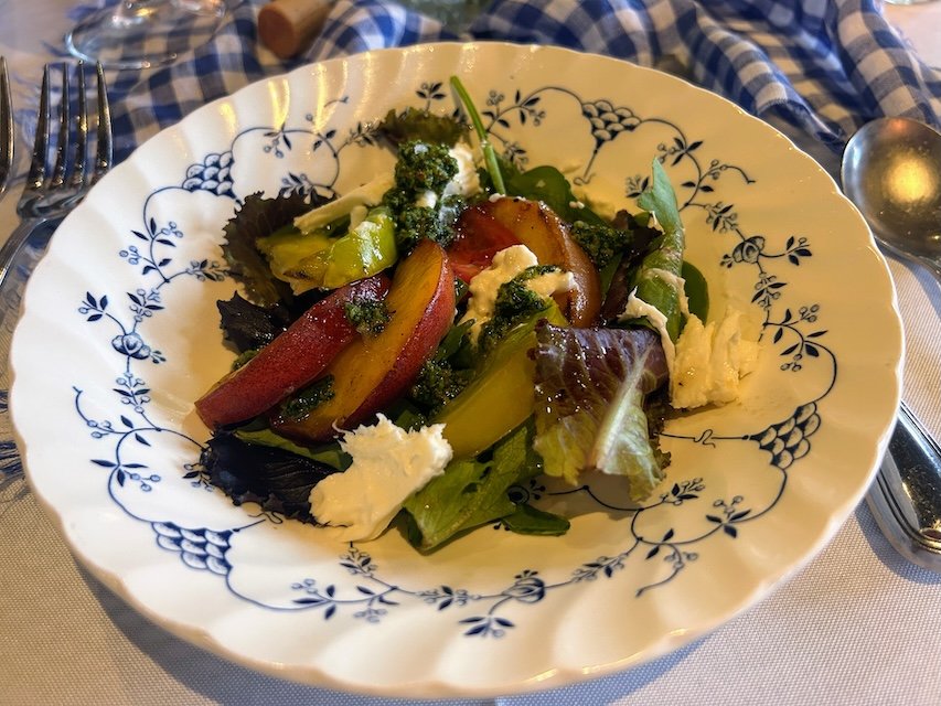 The salad course - peach and burrata with honey-lime dressing and cilantro jalapeño pesto.