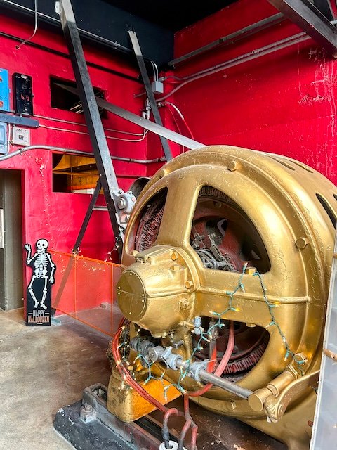 A giant electric motor with a pulley and belt that used to power the Sunshine Mill in The Dalles, Oregon.