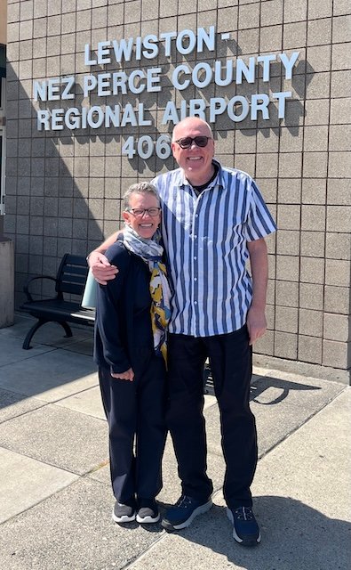 A photo of Mike and Mary in front of the Lewiston - Nez Perce County airport terminal on May 27, 2026.